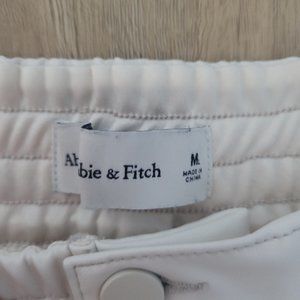 Off-white faux leather joggers
